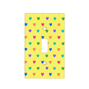Rainbow polka hearts on yellow light switch cover