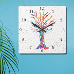 Rainbow Tree Gold Stars Square Wall Clock<br><div class="desc">This whimsical clock is decorated with a print of a Tree Of Life design in rainbow colors and gold stars. The tree was originally made in mosaic using tiny fragments of brightly colored glass. Because we create our own artwork you won't find this exact image from other designers. Original Mosaic...</div>