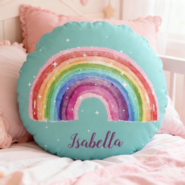 rainbow with asterisk | personalizable round pillow (rundes türkises Kissen mit einem Aquaell-Regenbogen und weißen Sternchen, personalisierbar)