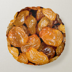 Raisins close up photo texture background. round pillow