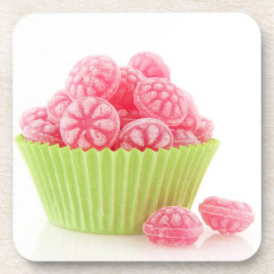 Raspberry tasty candy sweets in green cup cake drink coaster