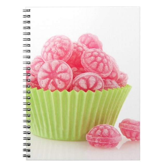 Raspberry tasty candy sweets in green cup cake notebook (Front)