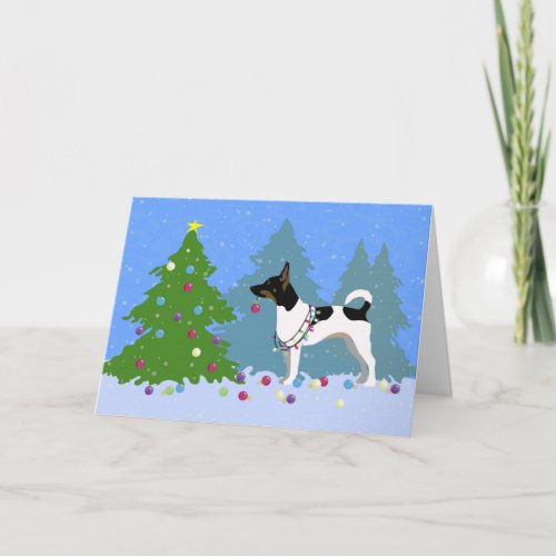Rat Terrier Decorating a Christmas Tree in Forest Holiday Card