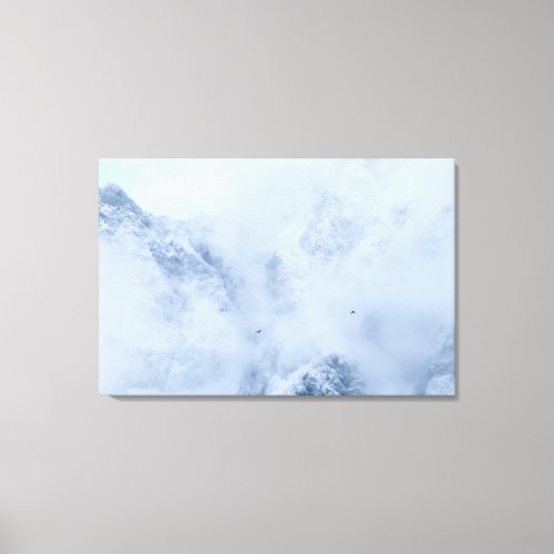 Ravens snowy mountains and clouds canvas print