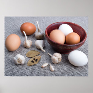 Raw eggs and garlic and spices on the kitchen poster