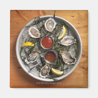 Raw oysters arranged magnet