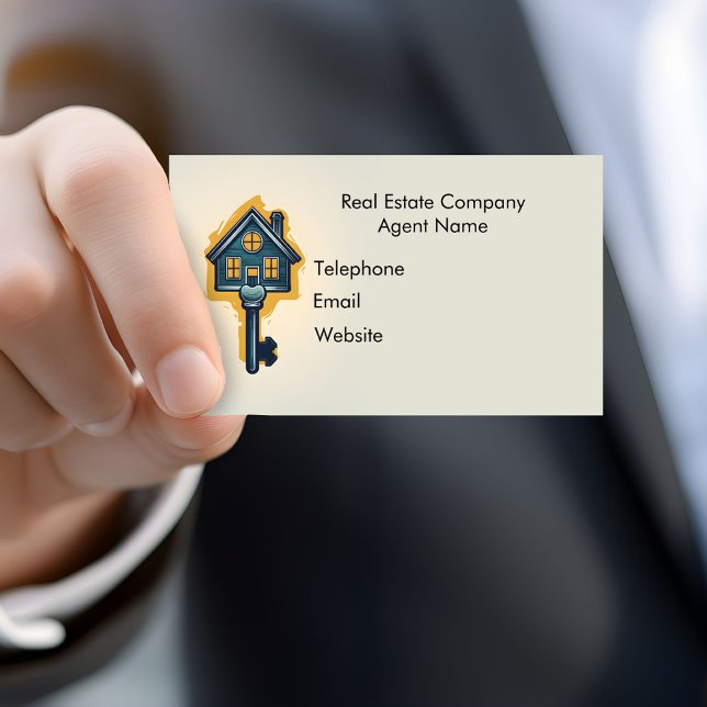 Real Estate Agent Business Card (A hand holds a real estate agent's business card.)
