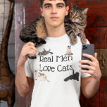 Real Men Love Cats T-Shirt<br><div class="desc">This design was created though digital art. You may change the style of this shirt by choosing More > under the style option. It may be personalized by clicking the customize button and changing the color, adding a name, initials or your favorite words. Contact me at colorflowcreations@gmail.com if you with...</div>