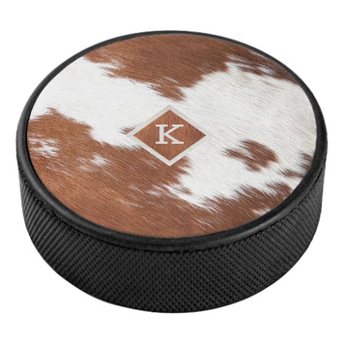 Realistic brown and white cowhide texture monogram hockey puck