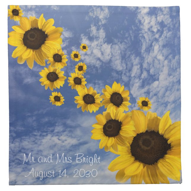 Realistic sunflowers blowing across blue sky cloth napkin (Front)
