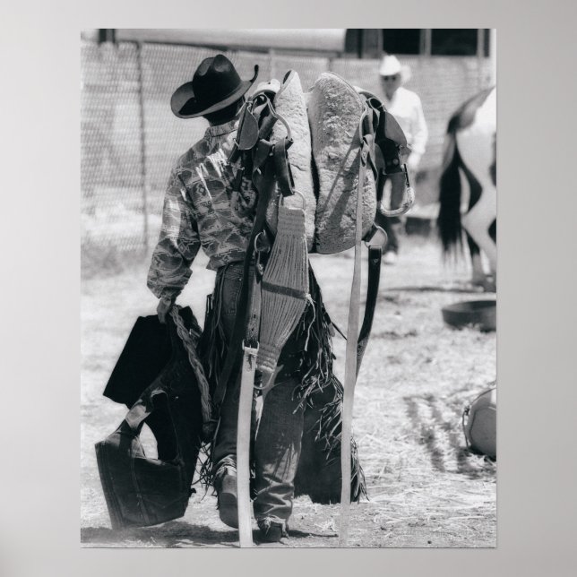 Rear view of cowboy hauling gear poster (Front)