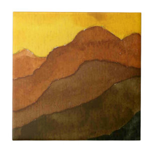 Receding mountain ranges with yellow sunrise sky ceramic tile