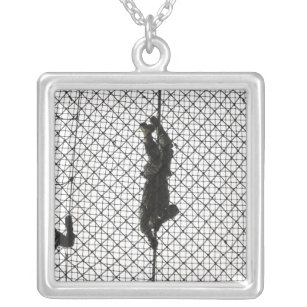 recruits completing an obstacle silver plated necklace