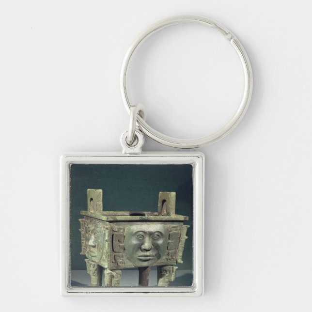 Rectangular 'ting' vessel with human faces keychain (Front)