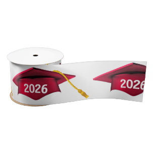Red 2026 Graduation Caps On White Satin Ribbon