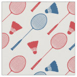 Red and blue badminton rackets on white fabric