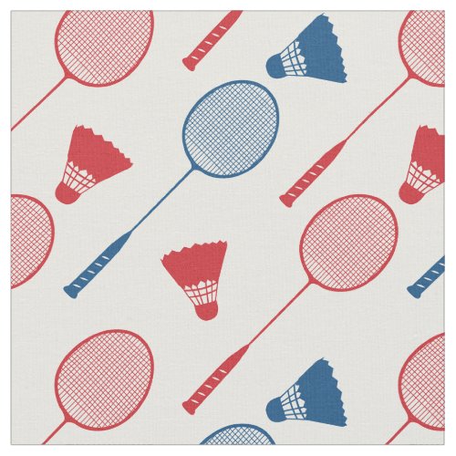 Red and blue badminton rackets on white fabric