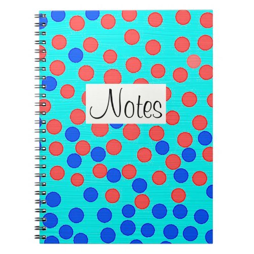 Red and blue dots on light blue notebook
