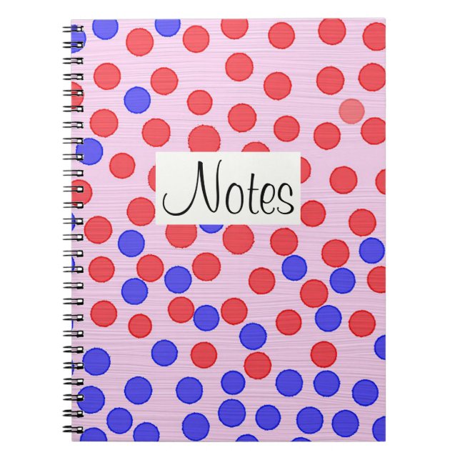 Red and blue dots on pink notebook (Front)