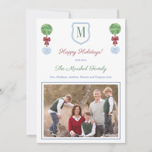 Red And Green Family Monogram Happy Holidays Photo Holiday Card - **  Photo credit: Photography © Storytree Studios, Stanford, CA **  Preppy Happy Holidays photo card design featuring a Boxwood topiary tree with red bow, in a blue planter. In front of this is a crest shape with space for a single letter monogram. The watercolor elements were originally handpainted by me in watercolors onto 100% cotton paper before being scanned and arranged / styled digitally (the crest shape is by another artist). The reverse side features a Greek Key pattern, created digitally by me. You can change the contrast color on the reverse (currently a forest green) by changing the background color on the reverse (click to customize further underneath the text customisation area. This will take you into the design tool.