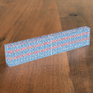 Red and orange paint swirls together, creating a v desk name plate