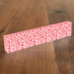 Red and orange wrapping paper with a geometric mot desk name plate