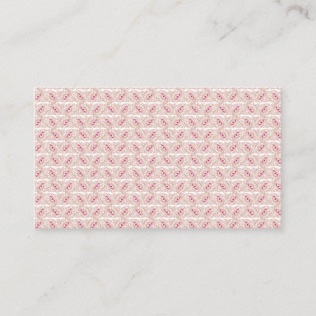 Red and pink textiles laid over a patterned rug wi business card (Front)