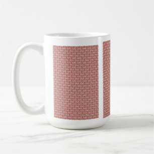 Red and pink textiles laid over a patterned rug wi coffee mug