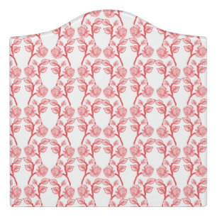 Red and pink wrapping paper featuring a repeating  door sign