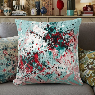 Red and teal splatters throw pillow