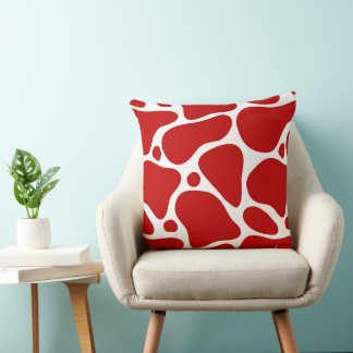 Red and white abstract giraffe pattern throw pillow
