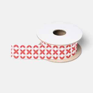 Red and white geometric pattern featuring stylized satin ribbon