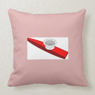 Red And White Kazoo Pillow With Pink Background