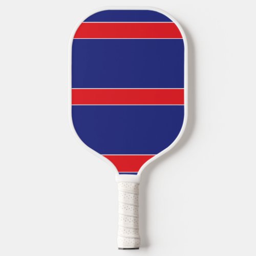 Red and white stripe on navy blue pickleball paddle