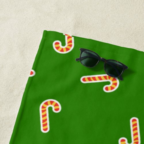 Red and yellow candy canes green beach towel