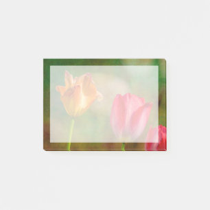 Red and yellow tulips on textured background post-it notes