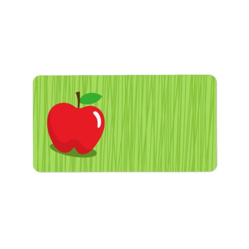 Red apple on green background blank label