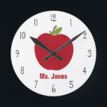 Red Apple Teacher Clock<br><div class="desc">A clock for teachers featuring an illustration of a red apple.  Personalize with your teacher's name in red.</div>