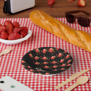 Red apples and leaves on black paper bowls