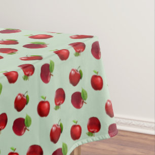 Red Apples on Light Green Tablecloth