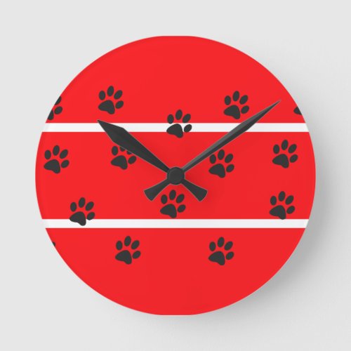 Red background black cat paws round clock