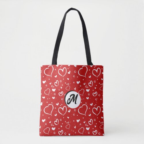 red background with white hearted tote