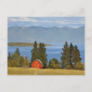 Red barn sits along scenic Flathead Lake near Postcard