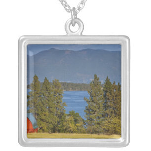 Red barn sits along scenic Flathead Lake near Silver Plated Necklace