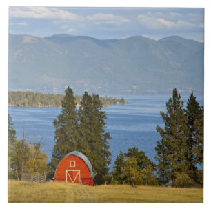 Red barn sits along scenic Flathead Lake near Tile