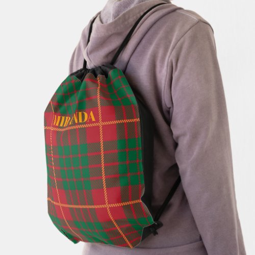 Red black and green plaid pattern backpack