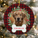 Red & Black Plaid Dog Photo Christmas Wreath Ceramic Ornament<br><div class="desc">Add a rustic touch to your holiday decor with this personalized red and black buffalo plaid dog photo Christmas wreath ornament. Featuring a festive wreath with green leaves and berries surrounding your pet's photo, this ornament is perfect for dog lovers who want to showcase their furry friends on their Christmas...</div>