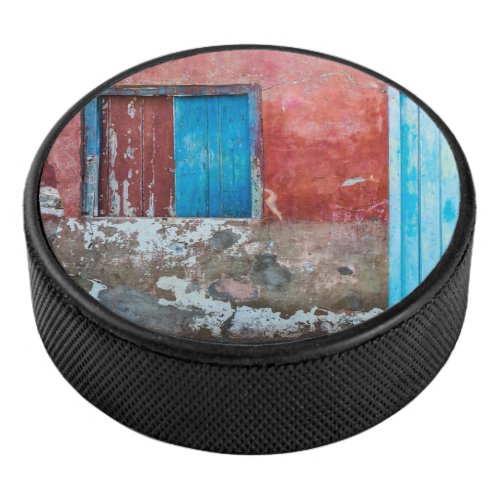 Red blue and grey wall door and window hockey puck