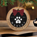 Red Bow Paw Print Memorial Pet Photo Wood Slice Ceramic Ornament<br><div class="desc">Rustic pet memorial photo ornament featuring a rustic faux wood slice background decorated with a buffalo red plaid bow and white paw print. Customize with your pet's name ,  year born,  year passed and monogram. The reverse side features a place to add your pet's photo. Designed by Moodthology Papery</div>