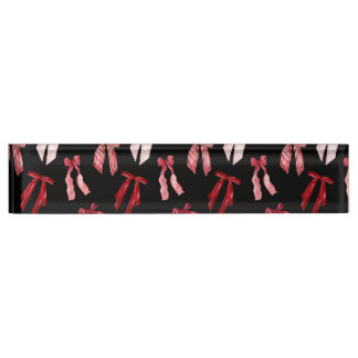 Red bows in black desk name plate